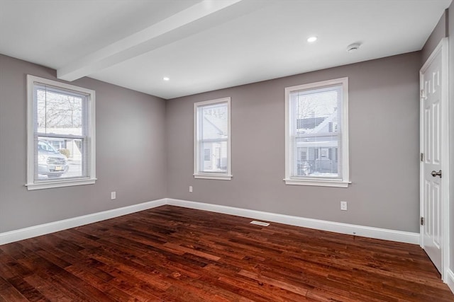 70 Sanborn St, Fitchburg, MA 01420 - unfurnished room featuring dark wood-type flooring, baseboards, beamed ceiling, recessed lighting, and a smoke detector