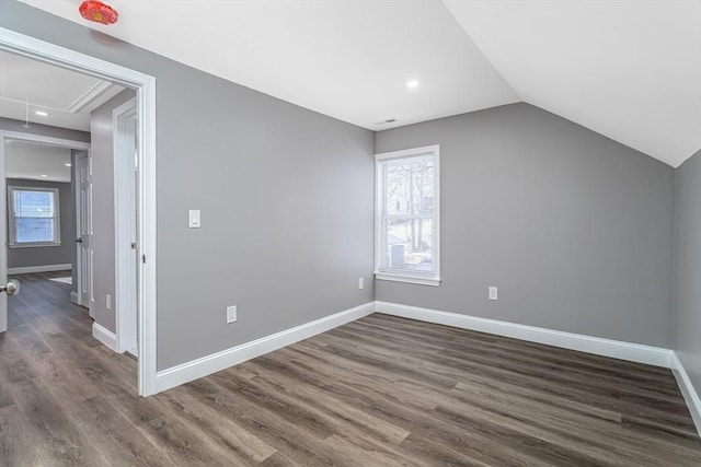 70 Sanborn St, Fitchburg, MA 01420 - bonus room featuring attic access, dark wood-style floors, plenty of natural light, vaulted ceiling, and baseboards