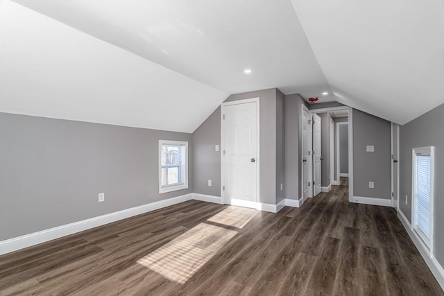 70 Sanborn St, Fitchburg, MA 01420 - additional living space with lofted ceiling, dark wood-style floors, baseboards, and recessed lighting