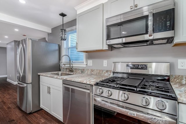 70 Sanborn St, Fitchburg, MA 01420 - kitchen with stainless steel appliances, dark wood-type flooring, a sink, white cabinets, and recessed lighting