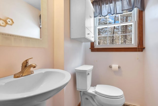 bathroom featuring sink and toilet