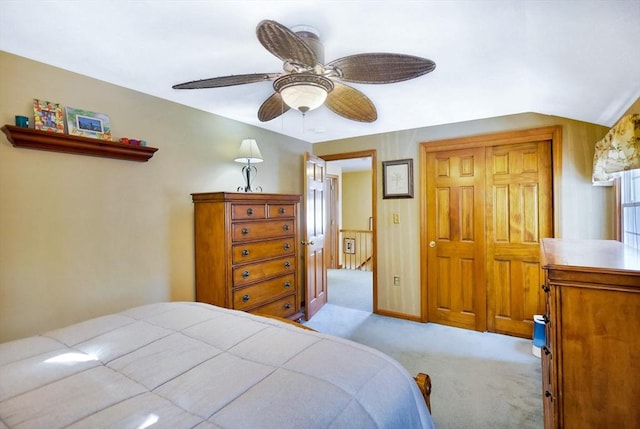 carpeted bedroom featuring vaulted ceiling and ceiling fan