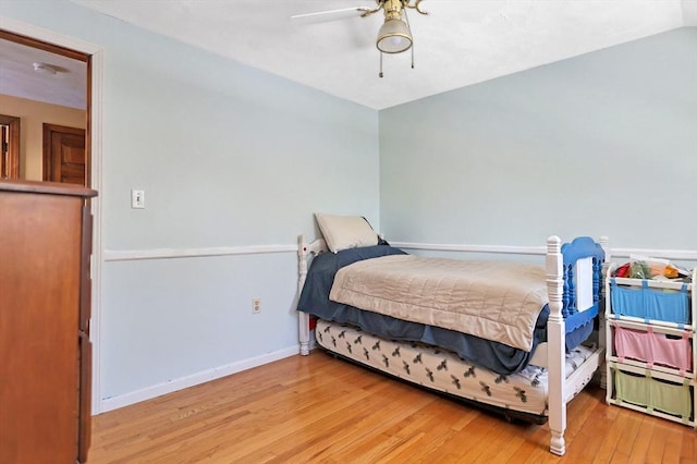 bedroom with ceiling fan and light wood-type flooring