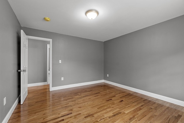 spare room with light hardwood / wood-style floors