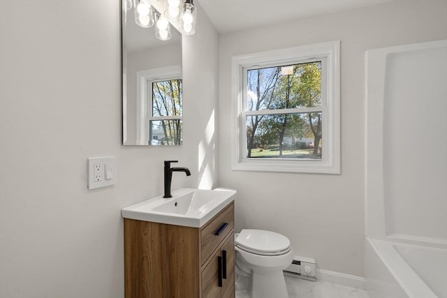 full bathroom with a baseboard radiator, baseboards, toilet, vanity, and marble finish floor