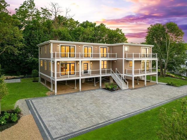 3 Colburn St Unit 1, Gloucester, MA 01930 - rear view of property featuring a balcony, a lawn, and a porch