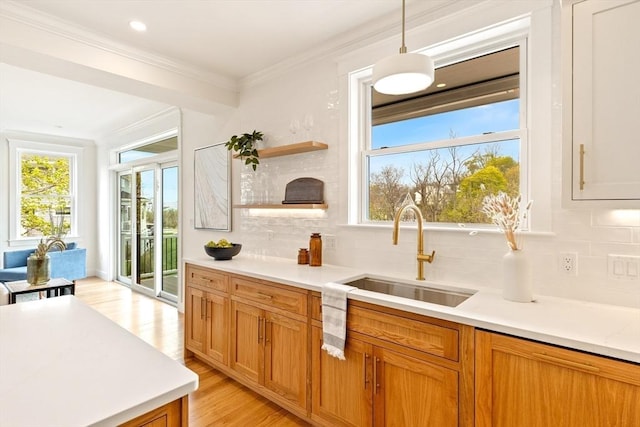 3 Colburn St Unit 1, Gloucester, MA 01930 - kitchen with light countertops, plenty of natural light, tasteful backsplash, ornamental molding, and recessed lighting
