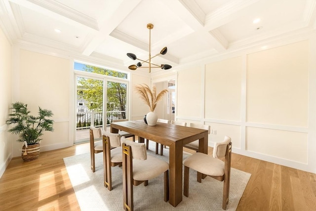 3 Colburn St Unit 1, Gloucester, MA 01930 - dining space featuring coffered ceiling, a decorative wall, light wood-style floors, beam ceiling, and crown molding