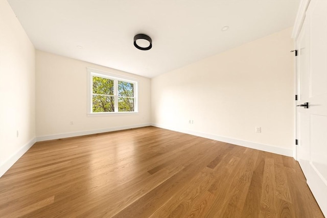 3 Colburn St Unit 1, Gloucester, MA 01930 - empty room with light wood-type flooring and baseboards