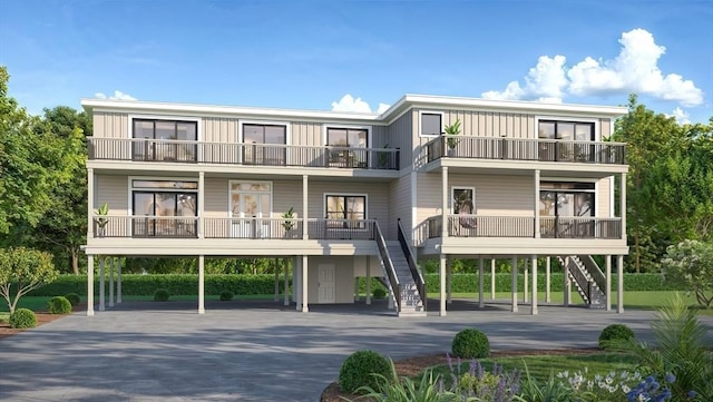 3 Colburn St Unit 1, Gloucester, MA 01930 - view of front of property with a balcony, stairway, and concrete driveway
