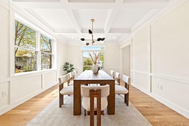 3 Colburn St Unit 1, Gloucester, MA 01930 - dining room with a decorative wall, light wood-type flooring, a chandelier, beam ceiling, and coffered ceiling