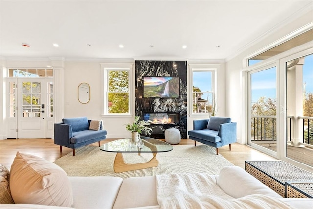 3 Colburn St Unit 1, Gloucester, MA 01930 - living room with wood finished floors, a fireplace, plenty of natural light, ornamental molding, and recessed lighting