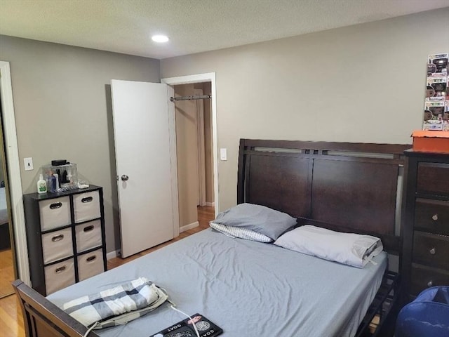 5 Hallmark Gdns Unit 6, Burlington, MA 01803 - bedroom featuring wood finished floors, recessed lighting, and a textured ceiling