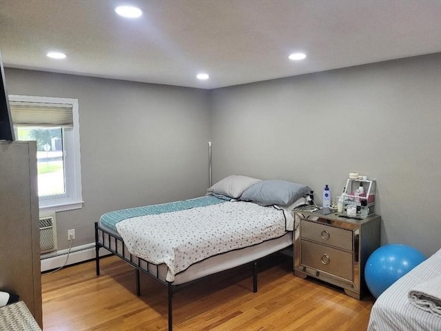 5 Hallmark Gdns Unit 6, Burlington, MA 01803 - bedroom with baseboard heating, light wood-type flooring, and recessed lighting