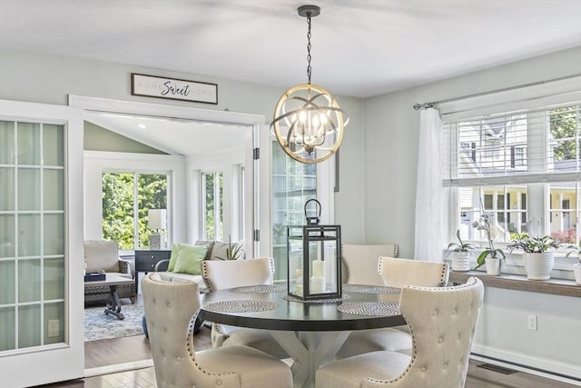 1 Woodland Ct Unit B, Milford, MA 01757 - dining area featuring a chandelier, plenty of natural light, and wood finished floors
