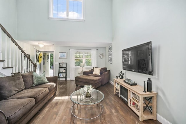 1 Woodland Ct Unit B, Milford, MA 01757 - living area with a towering ceiling, stairs, and wood finished floors