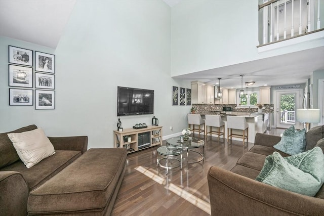 1 Woodland Ct Unit B, Milford, MA 01757 - living area featuring high vaulted ceiling and dark wood-style floors