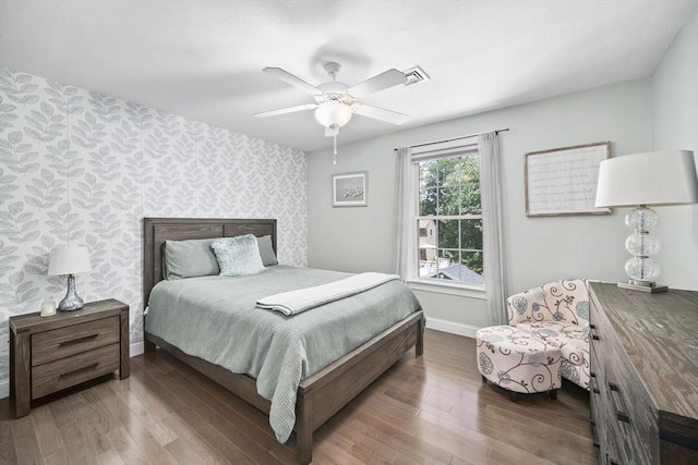 1 Woodland Ct Unit B, Milford, MA 01757 - bedroom featuring wallpapered walls, an accent wall, wood finished floors, and a ceiling fan