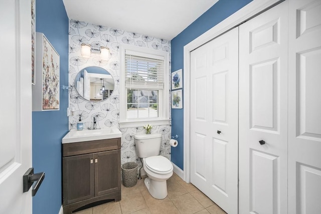 1 Woodland Ct Unit B, Milford, MA 01757 - half bath with a closet, vanity, tile patterned flooring, and wallpapered walls