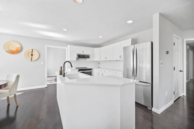 65 Sheffield Ter, Marlborough, MA 01752 - kitchen with stainless steel appliances, a sink, baseboards, dark wood-type flooring, and recessed lighting