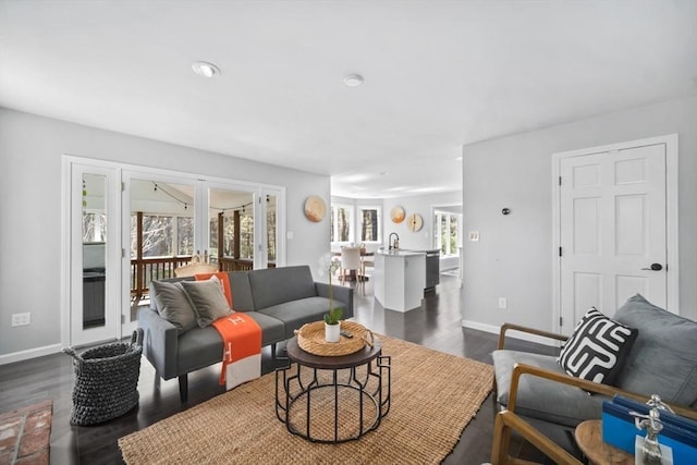 65 Sheffield Ter, Marlborough, MA 01752 - living area featuring dark wood-type flooring and baseboards