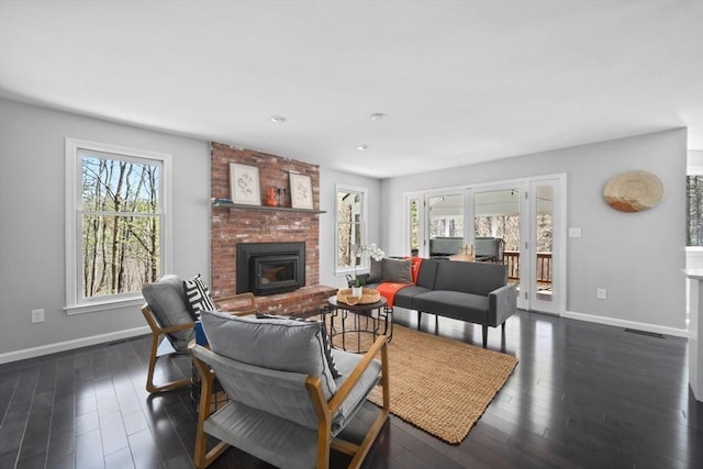 65 Sheffield Ter, Marlborough, MA 01752 - living area with baseboards, dark wood-type flooring, a fireplace, and french doors