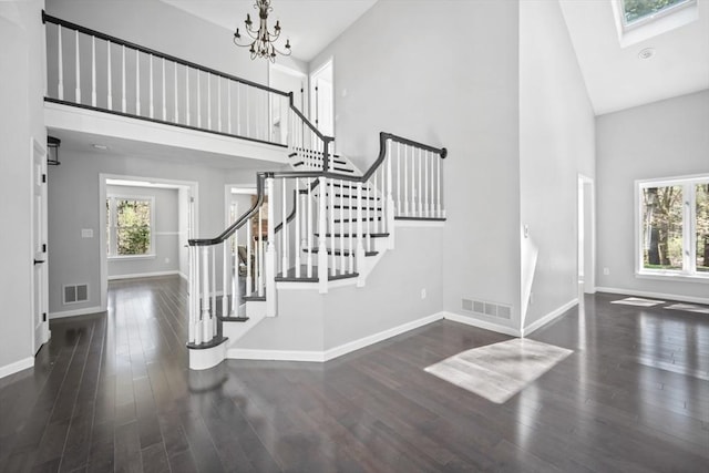 65 Sheffield Ter, Marlborough, MA 01752 - entrance foyer with high vaulted ceiling, baseboards, healthy amount of natural light, and stairway