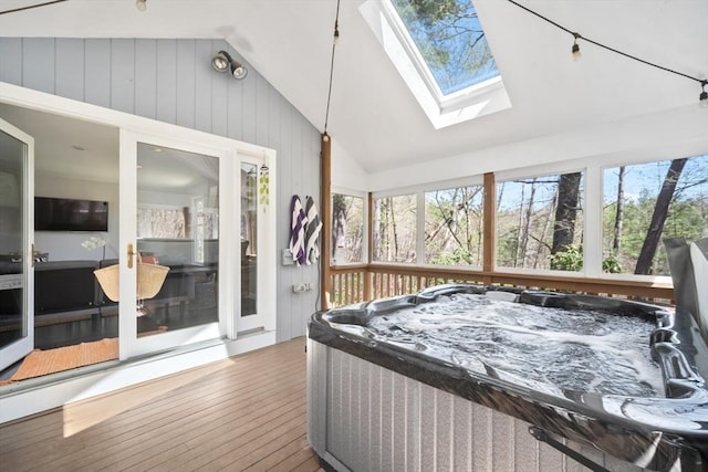 65 Sheffield Ter, Marlborough, MA 01752 - sunroom featuring a hot tub, lofted ceiling, a skylight, and plenty of natural light