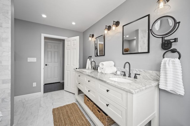 65 Sheffield Ter, Marlborough, MA 01752 - bathroom featuring marble finish flooring, double vanity, baseboards, and recessed lighting