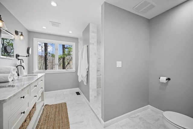 65 Sheffield Ter, Marlborough, MA 01752 - full bathroom featuring marble finish floors, toilet, double vanity, recessed lighting, and baseboards