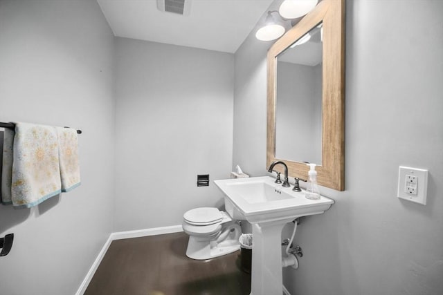 65 Sheffield Ter, Marlborough, MA 01752 - half bathroom with baseboards, toilet, and wood finished floors