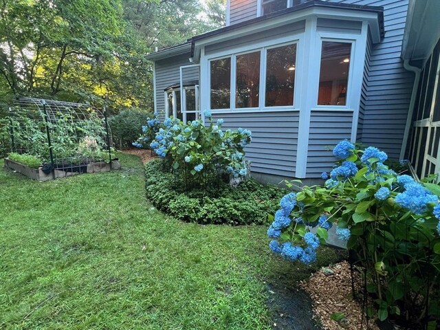 65 Sheffield Ter, Marlborough, MA 01752 - view of home's exterior with a vegetable garden and a yard