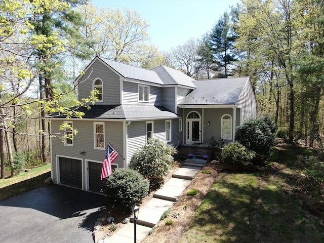 65 Sheffield Ter, Marlborough, MA 01752 - view of front facade featuring covered porch, an attached garage, and driveway