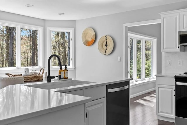 65 Sheffield Ter, Marlborough, MA 01752 - kitchen with dishwashing machine, electric range, a sink, healthy amount of natural light, and recessed lighting