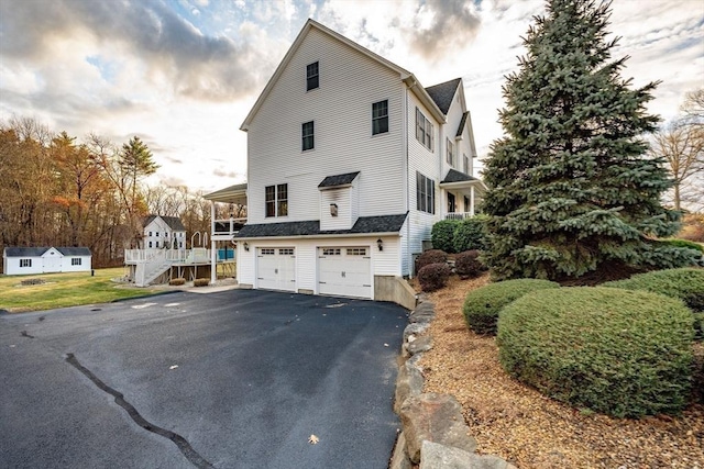 view of property exterior with a garage