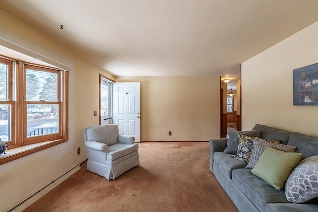 living area with carpet, a baseboard radiator, and baseboards