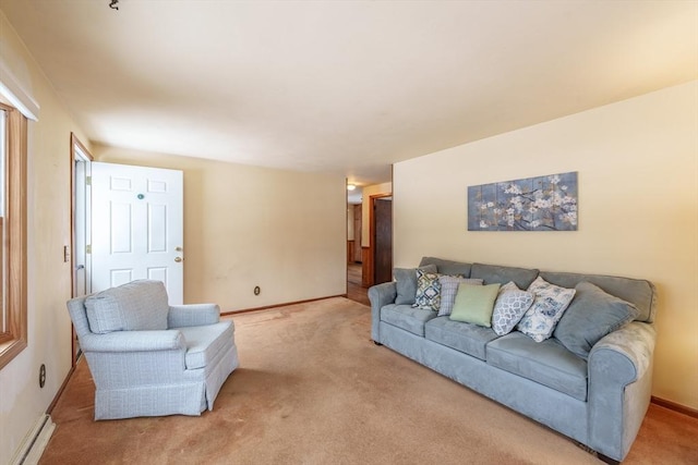 living room featuring a baseboard radiator, light colored carpet, and baseboards