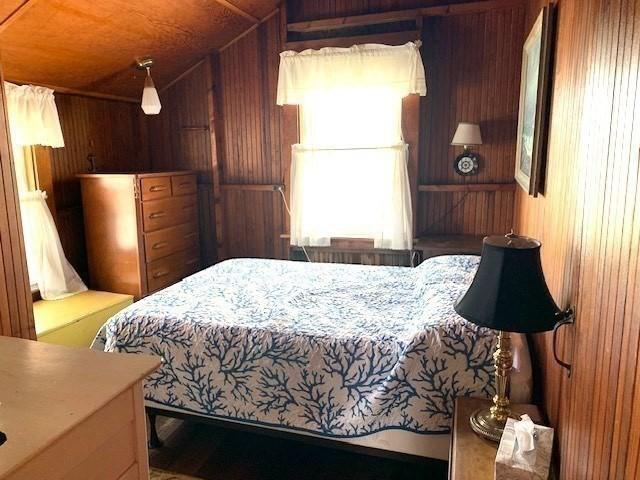 114 Long Bch, Rockport, MA 01966 - bedroom featuring wood walls, vaulted ceiling, and wood ceiling
