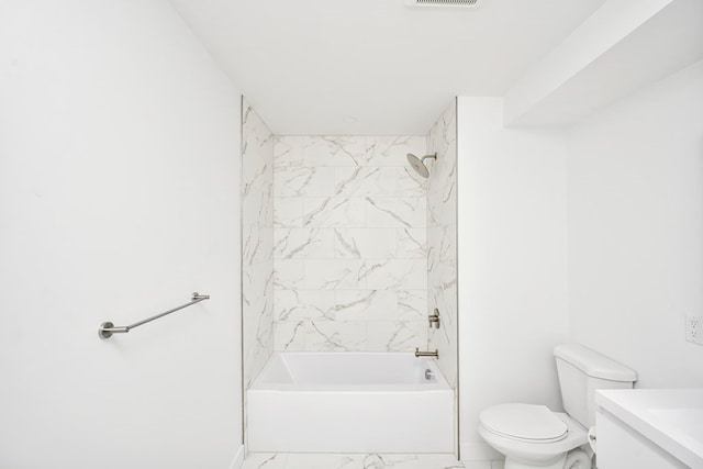 full bathroom featuring toilet, tile patterned floors, vanity, and tiled shower / bath