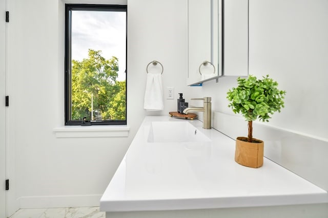 bathroom featuring tile patterned floors and vanity