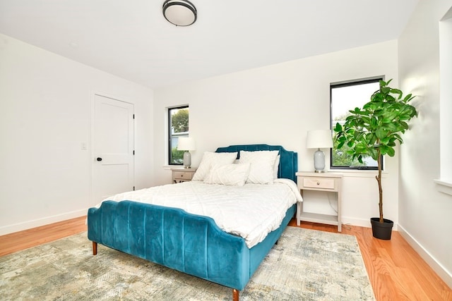 bedroom with light hardwood / wood-style flooring