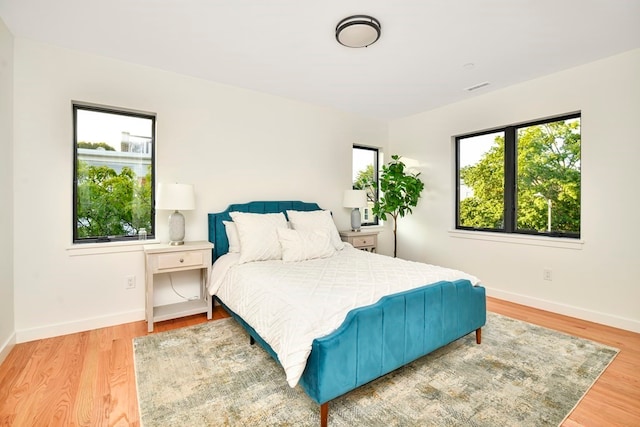 bedroom with light hardwood / wood-style flooring