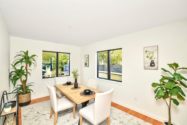 dining room with light wood-type flooring