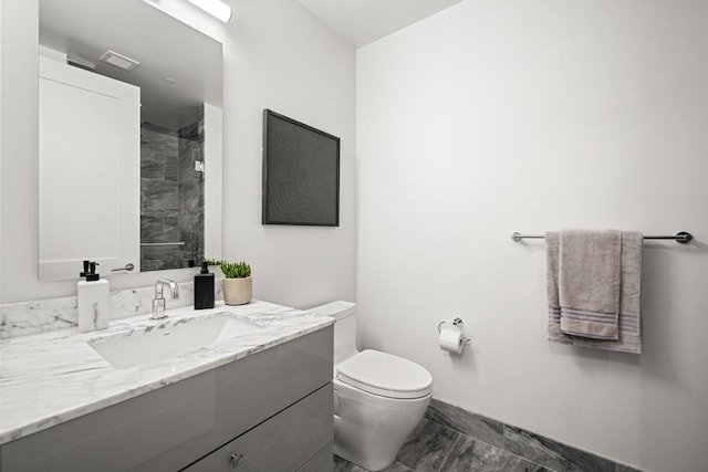 240 Devonshire St Unit 4003, Boston, MA 02110 - bathroom with marble look tiles, vanity, and a tile shower