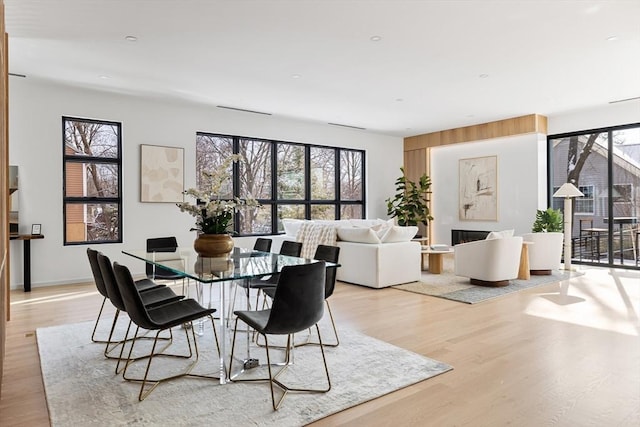 dining area featuring a healthy amount of sunlight and light wood-style floors