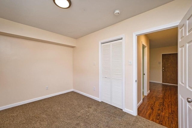 3652 N Main St Unit 4, Fall River, MA 02720 - unfurnished bedroom with a closet and dark carpet