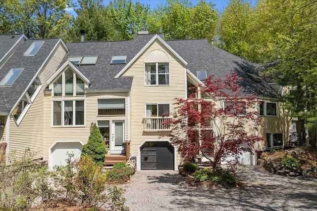 8 Deer Path Unit 8, Hudson, MA 01749 - view of front of home with a garage, roof with shingles, a chimney, and driveway