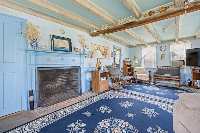 sitting room with beam ceiling