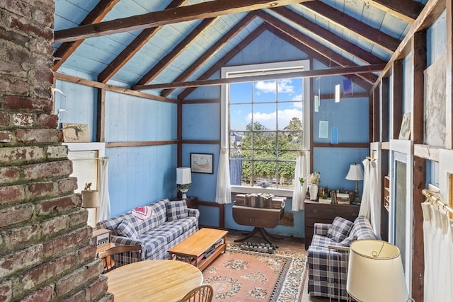 sunroom with vaulted ceiling with beams