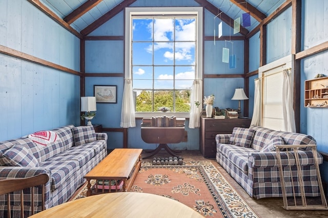 living room with high vaulted ceiling and beam ceiling